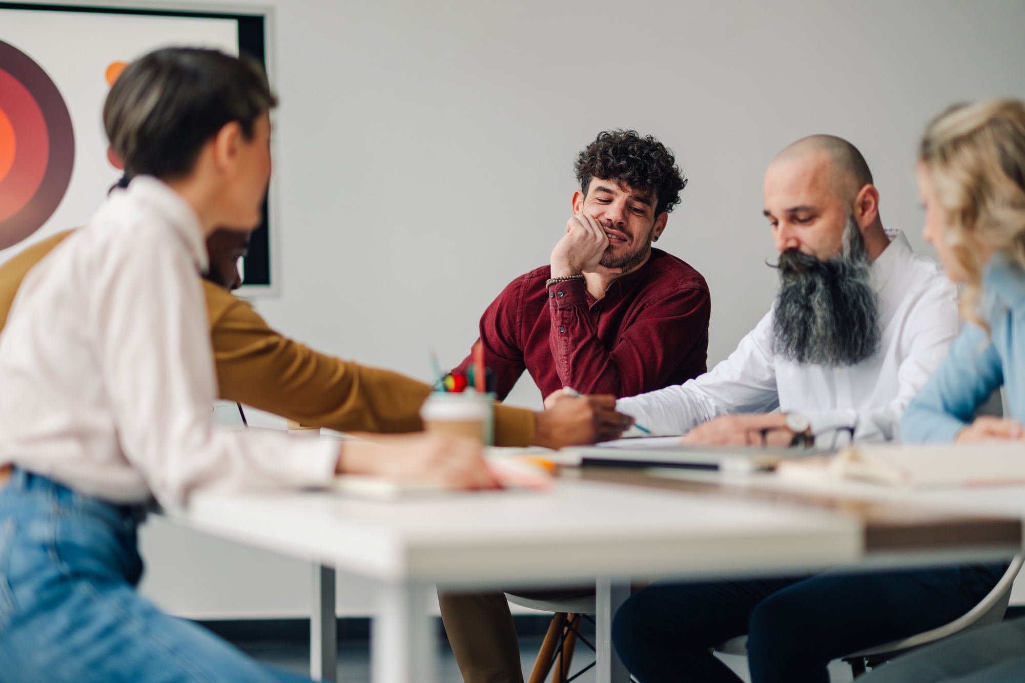 Marketing professionals collaborating on project during office meeting
